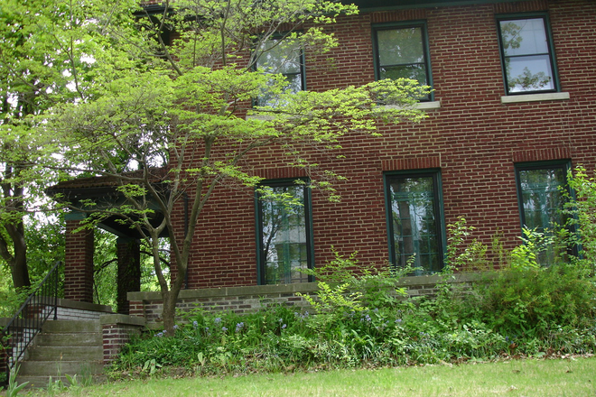 side-entrance full-house view, porch - House for rent across WashU, Central AC, Hardwood floors at 7000 Waterman Ave, University City, MO