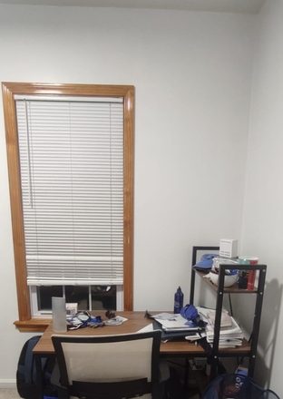 Bedroom window and desk - $1000 / Month-   Small South Facing Furnished Room in  large 3 Bedroom House(Somerville)