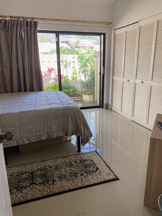 Modern, vaulted ceiling bedroom, stone floors, abundant light from garden and chest of drawers and ample closet space - Modern East Boca Furnished Room, private full bath Townhome