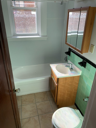 Visit hubrealtyproperties.com - Spacious studio with extra dining area, on Green line in Brighton Apartments