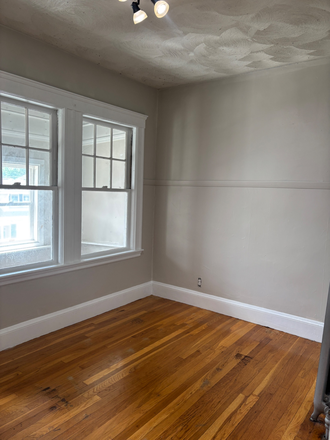 Bedroom with finished porch and closet for storage. - Newly renovated apartment close to Ball Square and I93