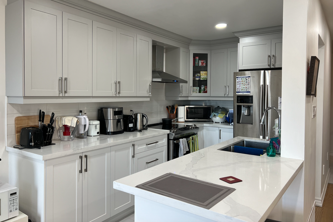 kitchen on main floor - $920 en-suite in the basement, $1160 bedroom on 1st floor