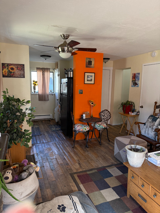 Living room, open to the kitchen - MOUNTAIN LIVING IN  CHARMINING NEDERLAND-WALK OUT YOUR DOOR TO MOUNTAIN SPORTS- YET 25 MI Duplex
