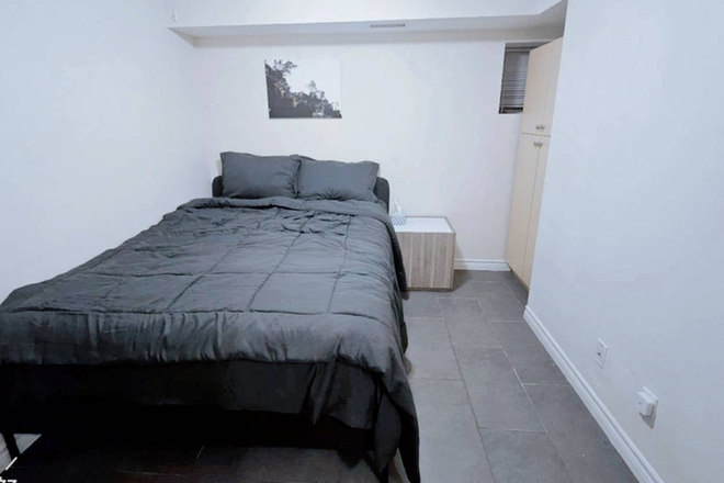 bedroom - Furnished 3 bedrooms unit in a basement Apartments