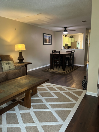 Living room / Dinning Room image from the deck - Snee Farm Lakes Fully Furnished Condo