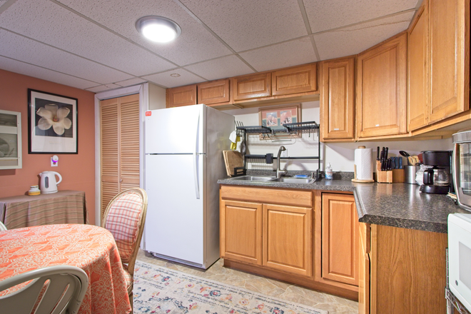 KITCHEN CABINETS - Comfy furnished one-bedroom apartment in private home with private bathroom and kitchen