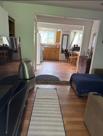 Living room - Private room in a two-bedroom unit downstairs located in a quiet neighborhood close to campus Apartments