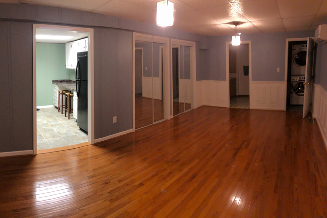 Main Room - looking front to back - Basement Studio Apartment w/patio (Old Greenbelt) - Convenient to UMCP campus, BARC and NASA