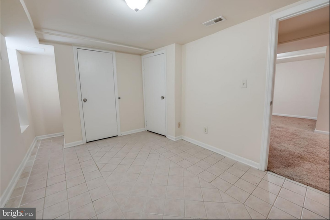 Tiled bedroom - 2 bed, 1 bath basement apartment. Easy bus access to campus. All utilities included in rent.