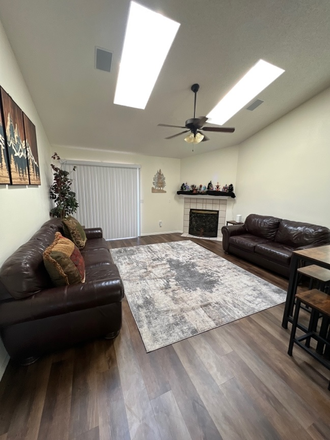 Living room with gas fireplace - Roommate Needed to Share AWESOME 5-Bedroom 3-Full Bathroom House with AWESOME roommates!