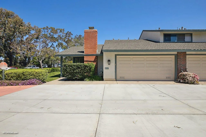 Garage entrance - Furnished Townhome walking distance to campus, next to park, access to pool and spa, 2 car garage.