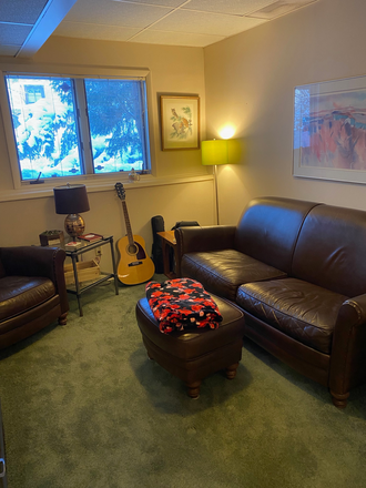Living room: new carpet, new leather sofa and chair. - Desnoyer House