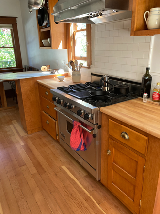 Kitchen, table/4 chairs in the back - Room with private bathroom in beautiful home  close to campus
