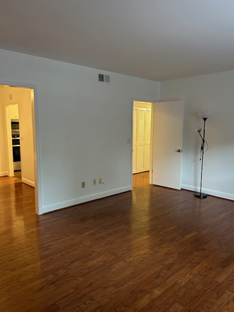 Large spacious open living room to dining room and hallway - Cozy 2bdrm. Harwood Condominium