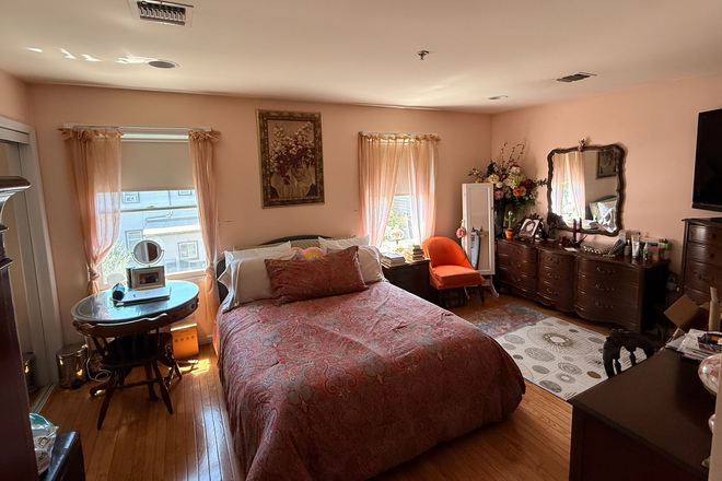 Primary bedroom with space for king bed and two large closets with en suite bathroom (identical unit) - Spacious beautiful 3 bedroom with quick commute to Manhattan Apartments