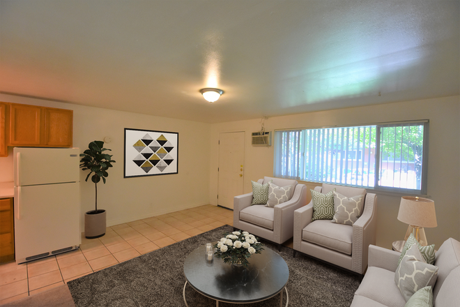 living room (staged photo, does not come furnished) - 2955 E. College Ave. (1BR/ 1BA) Apartments