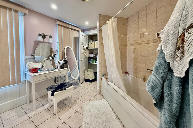 1 of 2 spacious bathrooms in unit - Bedroom 5 mins from campus with brand-new kitchen, spacious bathrooms and living room Townhome