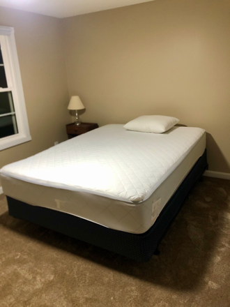 Queen size bed with headboard, nightstand with one lamp, one clock - Property address. 517 Benson Rd. Northbridge Massachusetts.