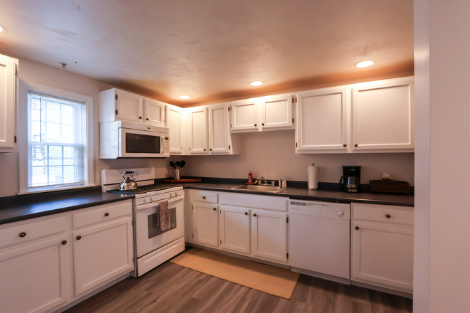 Kitchen has Gas Range and lots of cabinets for all storage needs! Floor is very open - JAY25C Rare, Multi-level, 3-Bed, 3-Bath, MIT House