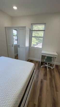 Furnished Sleeping Area with Dedicated Workspace - Private Furnished Studio Near UMD | Private Entrance & Bath | Utilities Included Apartments