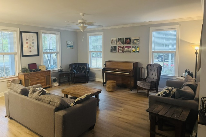 living area - large master suite, utilities included House