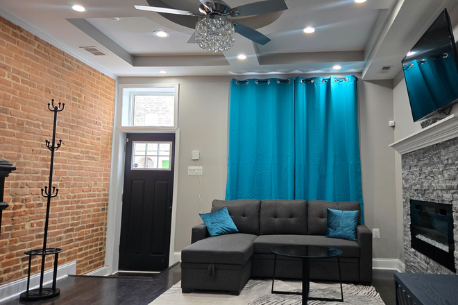 Living - main level - Baltimore Sanctuary Close to Hospital Townhome