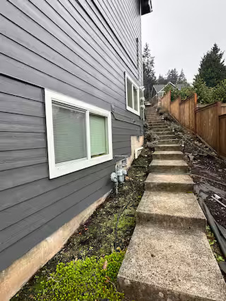 Stairs on the northside of the house to unit - Cozy with all the Amenities Apartments