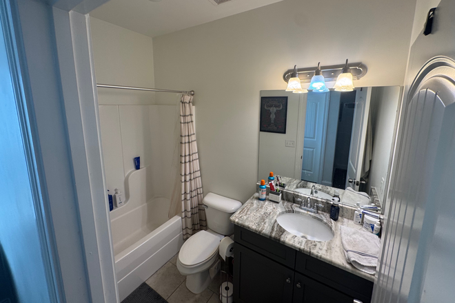 onsuite bathroom - Roommate Dream: 4BR/4.5BA Condo Just 6 Minutes from Campus