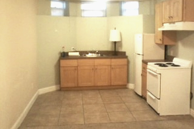 Visit hubrealtyproperties.com - Mission Hill, large garden level studio, on the green line T Apartments
