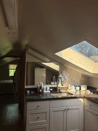 Sink and kitchen (includes sink, stove, fridge, and cabinets) - Upstairs Unit with Private Stairs Apartments