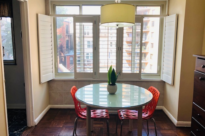 Dining room with plantation shutters. - DuPont Circle - Furnished Jr. 1- Bedroom. WIFI & utilities incl -1 block to Red Line Metro. Condo
