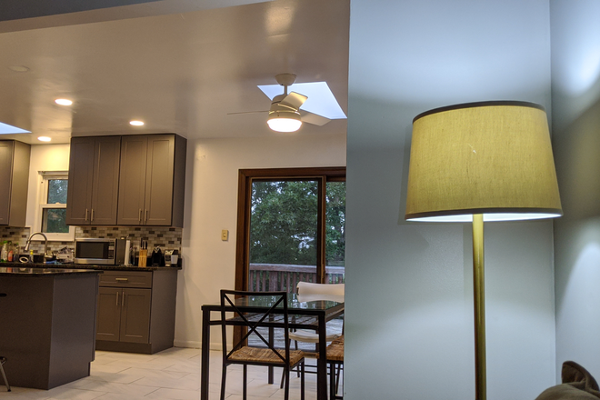 view from living room to deck and kitchen - Quiet room in renovated single house; walk to UMD; free parking; Graduate students