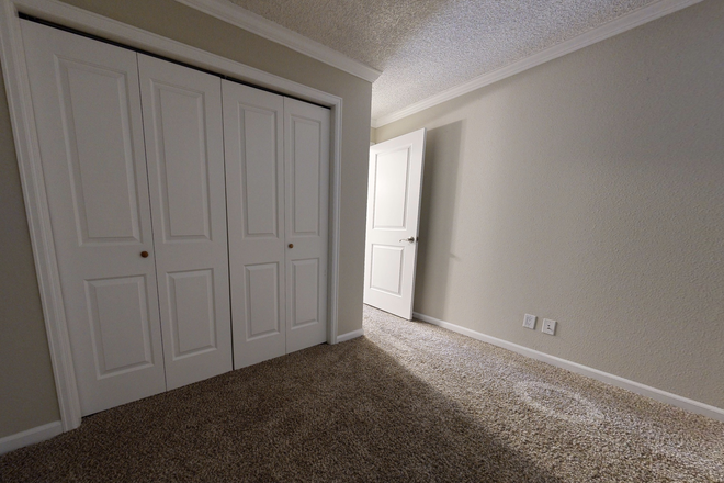 Bedroom (Window not pictured, it is just to the right of the image) - Flatiron View Apartments