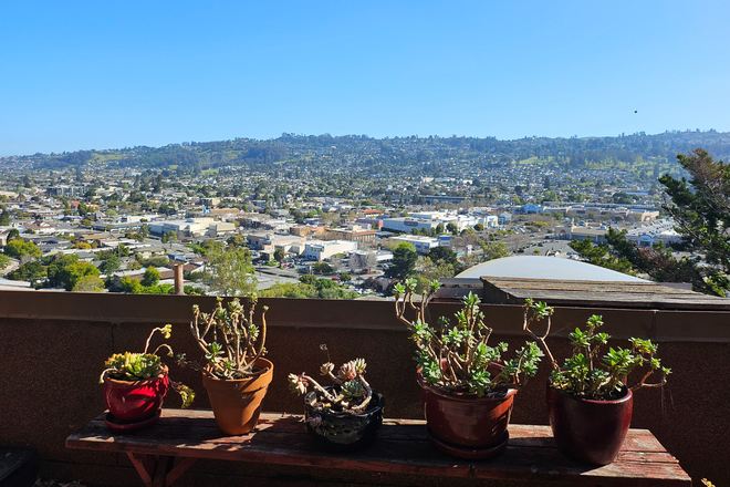 View from one of the decks/patio - Lovely bedroom with renovated private bathroom in quiet neighborhood