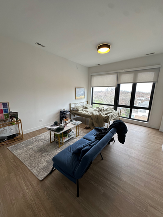 Bed area - Uptown Studio Apartments