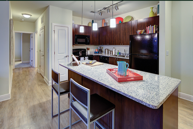 Kitchen and Bar area - University Crossings Apartments