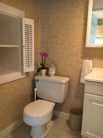 Bathroom w shower & 2 sorage shelves - studio apt in quiet, safe neighborhood. Utilities included: wifi, heat, electricity, and laundry