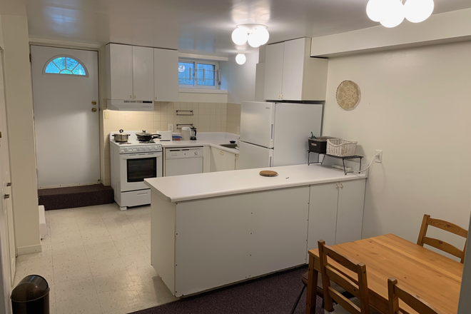 Kitchen and Dining Area - Furnished, 2-bedroom basement apartment for two occupants. Separate entrance. Bright. High ceilings.