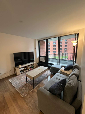 Living room, NW exposure with balcony access. - Modern 2 bed 1 bath | Summer sublet Apartments