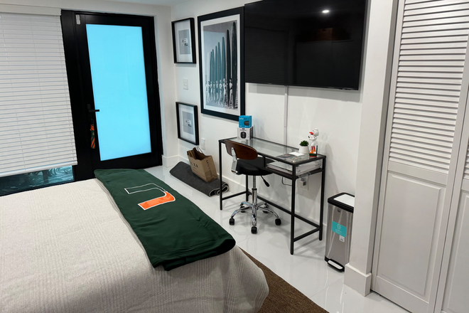 Desk and TV - Beautiful Garden Apartment