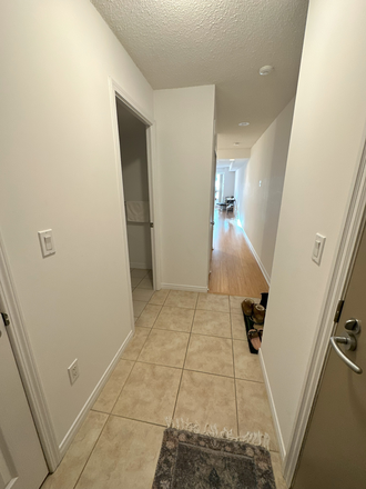 Entryway with Washer/Dryer Unit and Bathroom to the Left - Furnished Studio w/ Balcony & W/D In- Apartments Unit. 4 min walk to U of T.