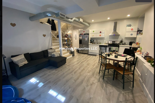 Kitchen and living room ( furnished, different from image) - Sublease Dudley st Apt, 20min direct bus ride to campus, modern amenities