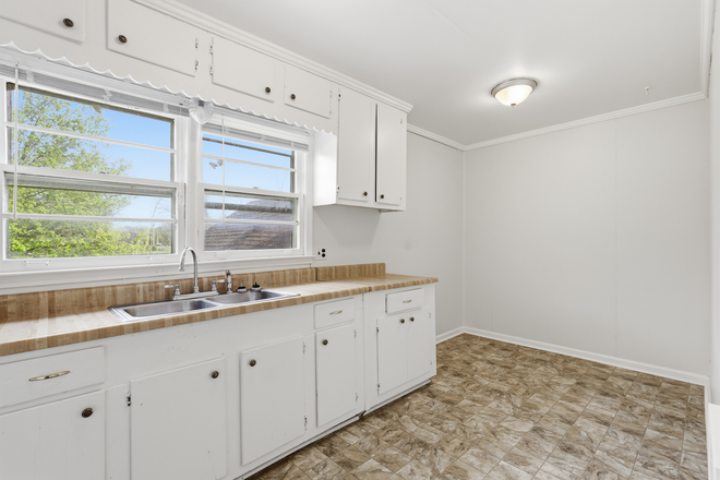 Kitchen 2 - 2-BR apartment minutes from campus, Wal-mart, Starbucks: water, lawncare, trash pickup include