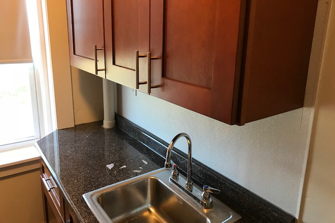 hubrealtyproperties.com - Front facing studio and new kitchen with dining area Apartments