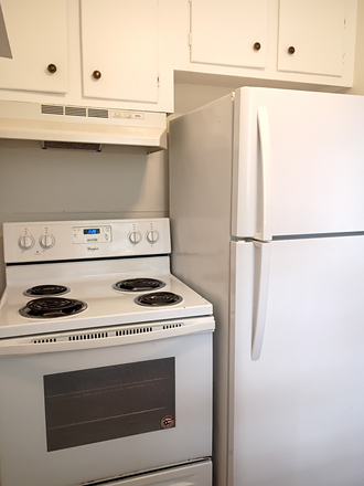 Kitchen 2 - 2-BR townhome in quiet area-laminate, hookups, central location-water, lawncare included