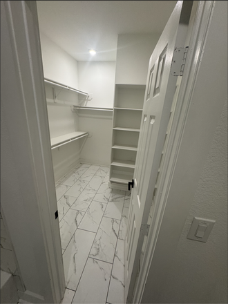 Master bedroom walk-in closet - Koaleh Homes – Furnished Rooms Near NRG & the Texas Medical Center