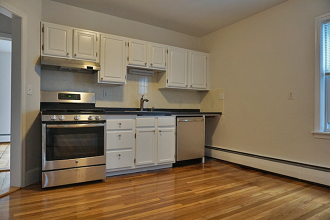 . - Spacious two bedroom plus unit with rear deck looking out on the Charles River Apartments