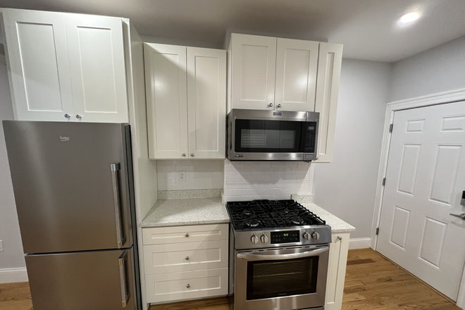 Kitchen - Modern 2 Bed/1 Bath Near Porter Square – In-Unit Laundry & Private Deck!