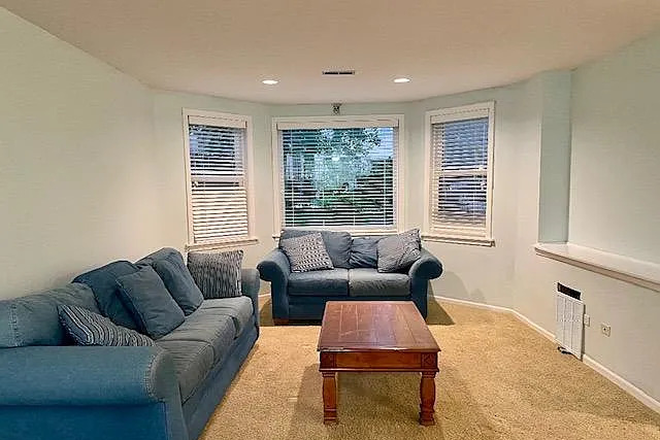 Living room area from Kitchen. NOTE: Furniture in photo not included with apartment - 2 Bed 1 Bath Apartment close to UIC West Campus