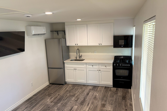 Living room, includes new Samsung smart TV - Sunny Private 1-Bedroom, 1 Bath, Washer and Dryer and Utilities Included House